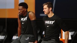 ORLANDO, FL – AUGUST 18: Bam Adebayo and Goran Dragic of the Miami Heat prior to the game against the Indiana Pacers for Game one of the first round of the 2020 Playoffs as part of the NBA Restart 2020 on August 18, 2020 at AdventHealth Arena at ESPN Wide World of Sports Complex in Orlando, Florida. NOTE TO USER: User expressly acknowledges and agrees that, by downloading and/or using this photograph, user is consenting to the terms and conditions of the Getty Images License Agreement. Mandatory Copyright Notice: Copyright 2020 NBAE (Photo by Jim Poorten/NBAE via Getty Images)