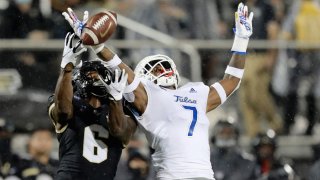 ORLANDO, ORLANDO, FL – OCTOBER 03:  TieNeal Martin #7 of the Tulsa Golden Hurricane breaks up a pass to Marlon Williams #6 of the Central Florida Knights at Bright House Networks Stadium on October 3, 2020 in Orlando, Florida. (Photo by Alex Menendez/Getty Images)