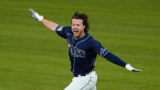 Tampa Bay Rays' Brett Phillips (14) celebrates the game winning hit against the Los Angeles Dodgers in Game 4 of the baseball World Series Saturday, Oct. 24, 2020, in Arlington, Texas. Rays defeated the Dodgers 8-7 to tie the series 2-2 games.