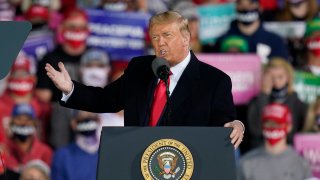 President Donald Trump speaks at a campaign rally at Des Moines International Airport, Wednesday, Oct. 14, 2020, in Des Moines, Iowa.