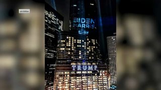 biden-harris campaign logo shines on Trump Tower in Chicago