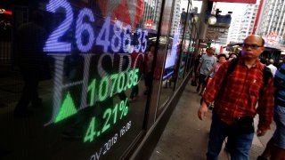 A panel displays the closing Hang Seng Index outside a bank in Hong Kong, China November 2, 2018.