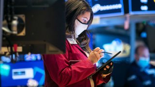 Traders work the floor of the New York Stock Exchange.