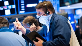 Traders work the floor of the New York Stock Exchange.