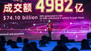Jiang Fan, president of Taobao and Tmall at Alibaba Group Holding Ltd., speaks as a final transaction figure is displayed at the gala event for Alibaba’s annual November 11 Singles’ Day online shopping event in Hangzhou, China, on Thursday, Nov. 12, 2020.