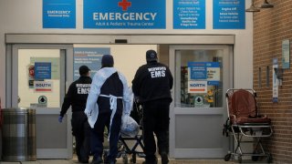 A patient arrives outside Maimonides Medical Center, as the spread of the coronavirus disease (COVID-19) continues, in Brooklyn, New York, U.S., November 17, 2020.