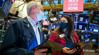 Traders work on the floor of the New York Stock Exchange.