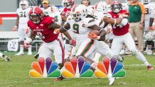 RALEIGH, NC - NOVEMBER 19: Miami Hurricanes wide receiver Malcolm Lewis (9) cuts upfield as North Carolina State Wolfpack defensive back Dravious Wright (8) gives chase during a game between NC State Wolfpack and Miami Hurricanes on November 19, 2016, at Carter-Finley Stadium in Raleigh, NC. The Hurricanes defeated the Wolfpack with a final score of 27 - 13. (Photo by Michael Berg/Icon Sportswire via Getty Images)