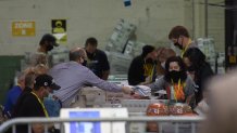 Allegheny County election employees organize ballots at the Allegheny County elections warehouse on November 7, 2020 in Pittsburgh, Pennsylvania. Biden edged Trump by over 34,000 votes on Saturday, giving Biden the 20 electoral college votes for the closely contested state.