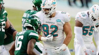 MIAMI GARDENS, FLORIDA – OCTOBER 18: Zach Sieler #92 of the Miami Dolphins reacts after a tackle for loss against the New York Jets at Hard Rock Stadium on October 18, 2020 in Miami Gardens, Florida. (Photo by Michael Reaves/Getty Images)