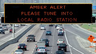 AMBER 1 / 05/14/05 -- Amber Alert is displayed on sign over westbound Highway 401 near Keele St. Pol