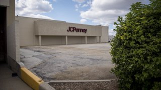 Signage is displayed outside a JC Penney Co. store in Chicago, Illinois.