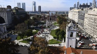 Piqueteros and social organizations demonstrate outside Casa Rosada government palace to demand more aid to survive the crisis caused during the lockdown imposed by the government against the spread of the new coronavirus, COVID-19, in Buenos Aires, on June 11, 2020.