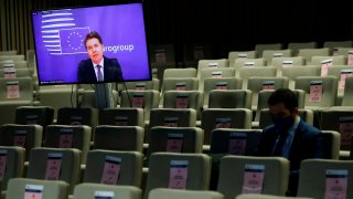 Eurogroup president Paschal Donohoe, on the screen, speaks during an online news conference following an Eurogroup video conference.