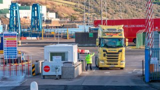 A lorry passes through security at the Port of Larne in Co Antrim, Northern Ireland on December 6, 2020.