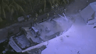 A 50-foot boat was destroyed a fire at a Pompano Beach home Wednesday morning.