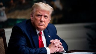 In this Nov. 26, 2020, file photo, President Donald Trump listens during a videoconference with members of military in the Diplomatic Room of the White House in Washington, D.C.