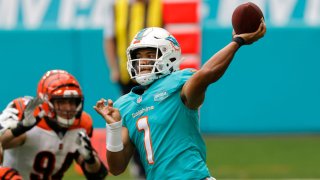 MIAMI GARDENS, FLORIDA – DECEMBER 06: Quarterback Tua Tagovailoa #1 of the Miami Dolphins throws a pass in the first quarter of the game against the Cincinnati Bengals at Hard Rock Stadium on December 06, 2020 in Miami Gardens, Florida. (Photo by Michael Reaves/Getty Images)