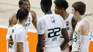 MIAMI, FLORIDA – DECEMBER 08: Anthony Walker #1 of the Miami Hurricanes huddles with the team against the Purdue Boilermakers during the second half at Watsco Center on December 08, 2020 in Miami, Florida. (Photo by Michael Reaves/Getty Images)