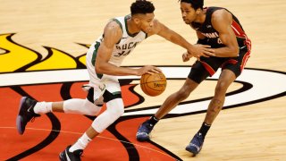 MIAMI, FLORIDA – DECEMBER 29: Giannis Antetokounmpo #34 of the Milwaukee Bucks drives against KZ Okpala #4 of the Miami Heat during the second quarter at American Airlines Arena on December 29, 2020 in Miami, Florida. NOTE TO USER: User expressly acknowledges and agrees that, by downloading and or using this photograph, User is consenting to the terms and conditions of the Getty Images License Agreement. (Photo by Michael Reaves/Getty Images)