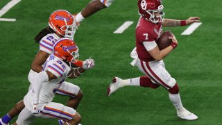 ARLINGTON, TEXAS – DECEMBER 30: Quarterback Spencer Rattler #7 of the Oklahoma Sooners runs against the Florida Gators during the fourth quarter at AT&T Stadium on December 30, 2020 in Arlington, Texas. (Photo by Carmen Mandato/Getty Images)