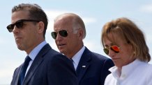 Family members gather for a road naming ceremony with U.S. Vice President Joe Biden, centre, his son Hunter Biden, left, and his sister Valerie Biden Owens, right, joined by other family members during a ceremony to name a national road after his late son Joseph R. "Beau" Biden III, in the village of Sojevo, Kosovo, on Wednesday, Aug. 17, 2016.  President Joe Biden is the guest of honor during the street dedication ceremony naming the national road Joseph R. "Beau" Biden III.AP Photo/Visar Kryeziu)