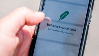 The Robinhood vestment app is see on a smartphone in this photo illustration on June 24, 2020 in Washington,DC. -