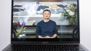 A video recording of a livestream of Jack Ma, co-founder of Alibaba Group Holding Ltd., addressing teachers at an annual event he hosts to recognize rural educators, on a laptop computer arranged in Hong Kong, China, on Wednesday, Jan. 20, 2021. Ma has resurfaced after months out of public view that fueled intense speculation about the plight of the billionaire grappling with escalating scrutiny over his internet empire.