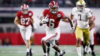 Wide receiver DeVonta Smith #6 of the Alabama Crimson Tide rushes for a touchdown over the defense of Notre Dame Fighting Irish during the second quarter of the 2021 College Football Playoff Semifinal Game at the Rose Bowl Game presented by Capital One at AT&T Stadium on Jan. 1, 2021 in Arlington, Texas.