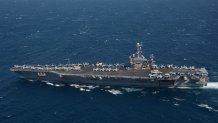 The U.S. Navy aircraft carrier USS Harry S. Truman, a "clean" ship free from the coronavirus disease (COVID-19) thanks to a longer-than-expected deployment at a sea, transits the Strait of Gibraltar April 7, 2020. Picture taken April 7, 2020.