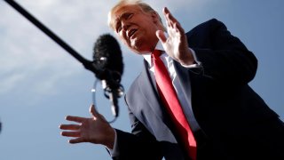 U.S. President Donald Trump speaks to reporters as he arrives at Phoenix Sky Harbor International Airport in Phoenix, Arizona, October 19, 2020.