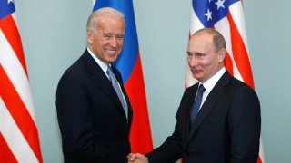 FILE - In this March 10, 2011, file photo, then-Vice President Joe Biden, left, shakes hands with Russian Prime Minister Vladimir Putin in Moscow, Russia. Russia and the United States exchanged documents Tuesday Jan. 26, 2021, to extend the New START nuclear treaty, their last remaining arms control pact, the Kremlin said. The Kremlin readout of a phone call between U.S. President Joe Biden and Russian President Vladimir Putin said they voiced satisfaction with the move.