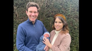 Britain's Princess Eugenie and her husband, Jack Brooksbank pose for a photo with their son