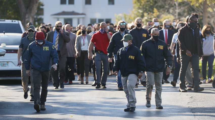 FORT LAUDERDALE, FLORIDA – FEBRUARY 02:  Law enforcement members leave the Broward County Office of Medical Examiner and Trauma Services after the killing of two FBI agents on February 02, 2021 in Sunrise, Florida. The FBI agents were killed in the City of Sunrise, Florida as they were executing a federal-search warrant in a crimes-against-children case. (Photo by Joe Raedle/Getty Images)