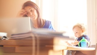 A young mother multitasking