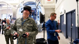 Chief Master Sgt. Marty Rush, Air Force Space Command Public Affairs chief enlisted manager at Peterson Air Force Base working in virtual reality at the Digital Twin Demo with NextSTEP Lunar Habitat at the Lockheed Martin Space Waterton Facility. April 16, 2018 Littleton, CO