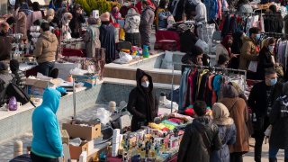 In this Feb. 26, 2021, file photo, crowds gather at the Parvaneh Friday market in central Tehran amid the new coronavirus disease outbreak in Iran.