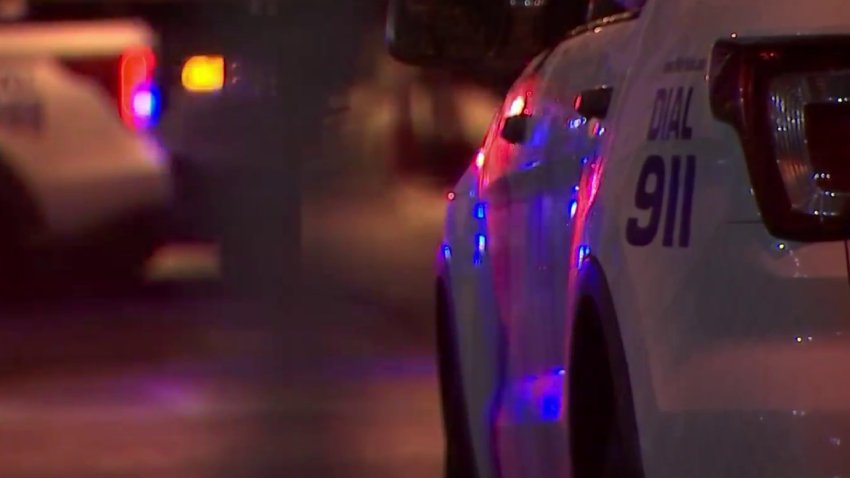 Side of a Philadelphia police car at night