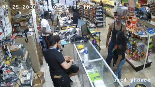 In this image from store video, George Floyd, right, is seen inside Cup Foods on May 25, 2020, in Minneapolis.