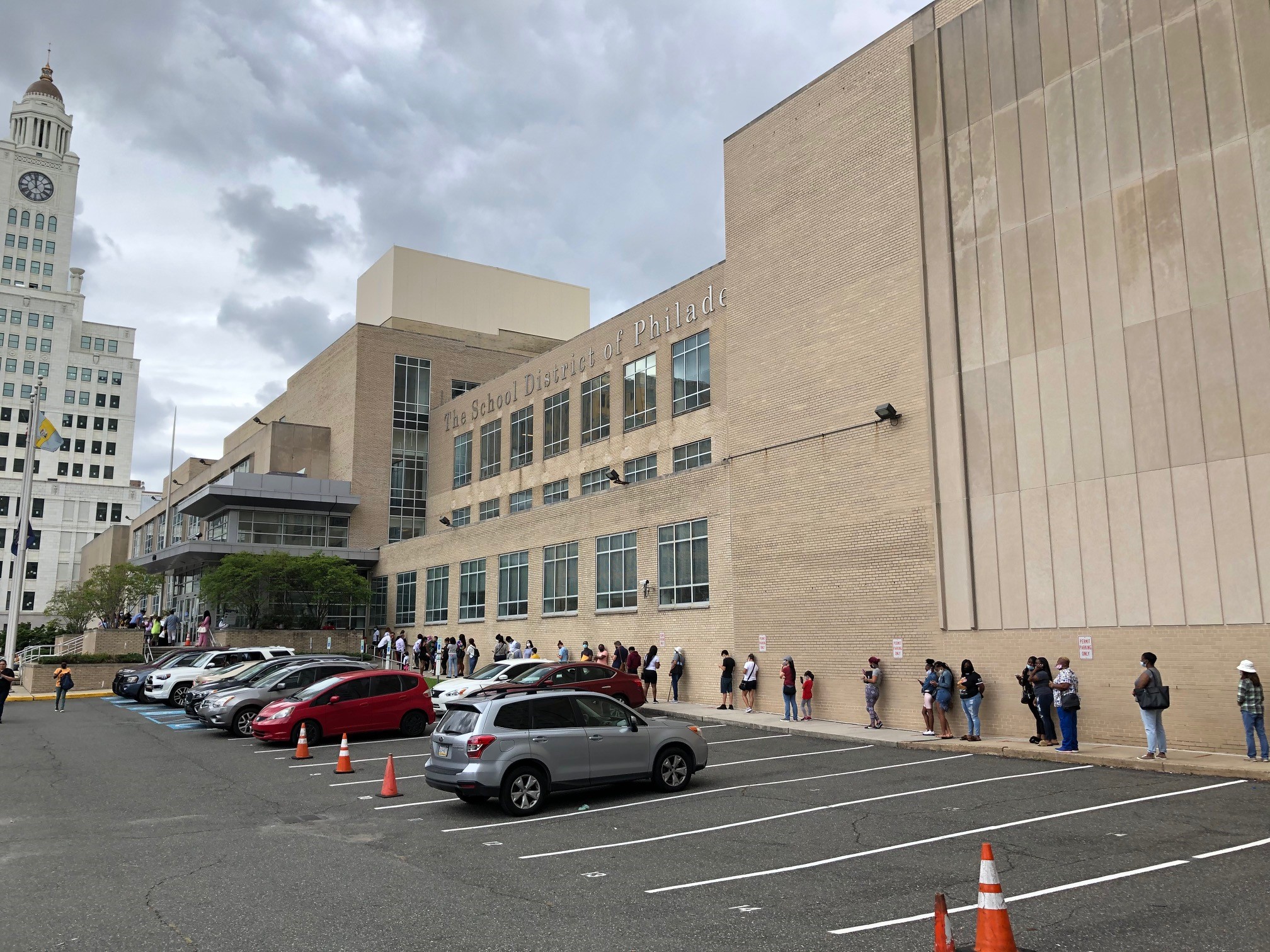 When city schools closed, the School District handed out Chromebooks to students -- and a socially distanced line to pick them up stretched around the district headquarters. (Photo: Dave Palmer / NBC10)