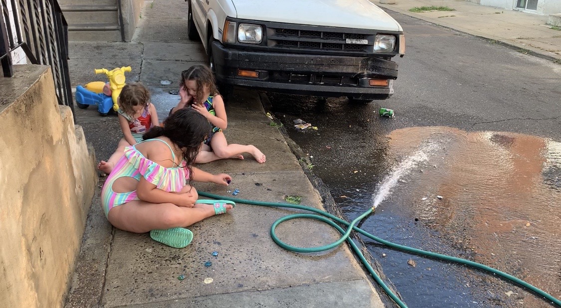 Kids made do in the summer, as they always do, with a water hose and some toys. This was taken on July 3. (Photo: Aaron Baskerville / NBC10)