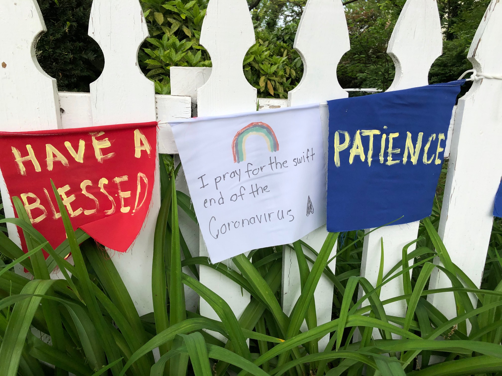 Hand-painted prayer signs urge "patience," also in Philadelphia's Roxborough neighborhood. (Photo: Dave Palmer / NBC10)
