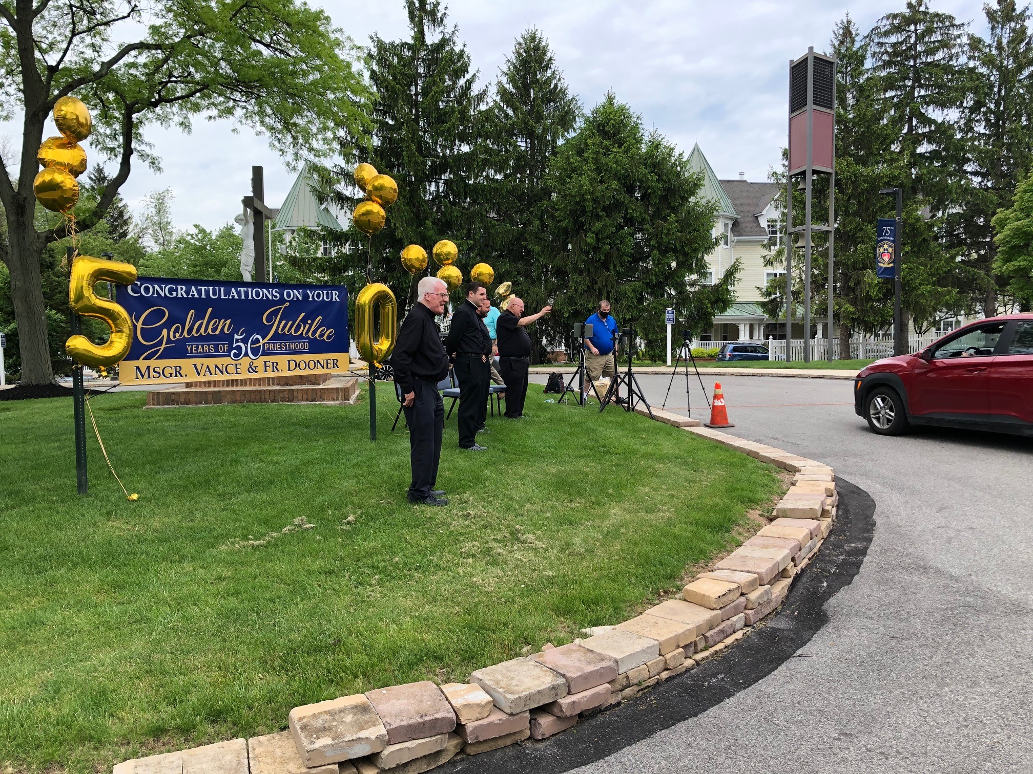Priests had to celebrate their 50-year golden jubilee in the church with a drive-by. (Photo: Dave Palmer / NBC10)