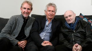 Genesis band members from left, Mike Rutherford, Tony Banks, and Phil Collins pose for a photo