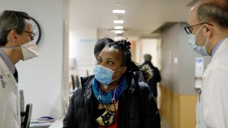 Trachea transplant recipient Sonia Sein talks with the lead surgeon of her procedure, Dr. Eric Genden, left, and Dr. Sandy Florman during a checkup visit at Mt. Sinai hospital in New York on Monday, March, 22, 2021. Doctors say this operation could help other people including COVID-19 patients left with serious windpipe damage from breathing machines.