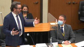 In this image from video, defense attorney Eric Nelson, left, discusses motions before the court as defendant, former Minneapolis police officer Derek Chauvin, right, and Nelson's assistant Amy Voss, back, listen, Monday, April 12, 2021, as Hennepin County Judge Peter Cahill presides over the trial of Chauvin at the Hennepin County Courthouse in Minneapolis. Chauvin is charged in the May 25, 2020 death of George Floyd.