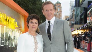 Actors Helen McCrory, left, and Damian Lewis appear at the premiere of "Once Upon A Time in Hollywood," in London on July 30, 2019. McCrory, who starred in the television show “Peaky Blinders” and the “Harry Potter” movies, has died. She was 52 and had been suffering from cancer. Her husband, actor Damian Lewis, said Friday that McCrory died “peacefully at home” after a "heroic battle with cancer.”