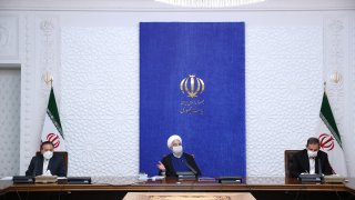 Iranian President Hassan Rouhani (C) makes a speech on Iran's foreign policy and economic crisis as he gathers with economists in Tehran, Iran on April 26, 2021.
