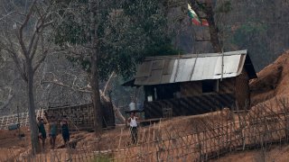 In this March 30, 2021, file photo, Myanmar soldiers stand at a small army camp along the river bank near the border of Myanmar and Thailand. Ethnic Karen guerrillas said they captured the Myanmar army base Tuesday, April 27, 2021 in what represents a morale-boosting action for those opposing the military's takeover of the country's civilian government in February.