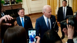 U.S. President Joe Biden, right, and Moon Jae-in, South Korea's president, depart from a news conference in the East Room of the White House in Washington, D.C., U.S., on Friday, May 21, 2021.